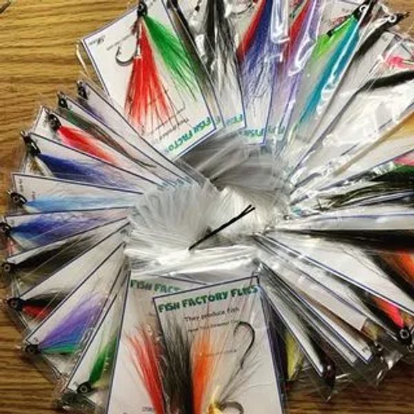 A variety of colorful fishing lures arranged in a circular pattern on a wooden surface.