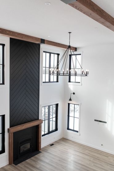 fireplace feature wall open concept open to below windows launch homes custom home builder