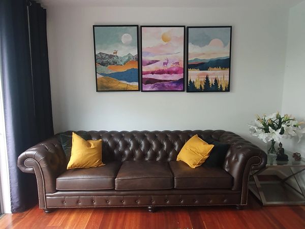 Leather sofa in cluttered living room before decorating by Simpson Interiors