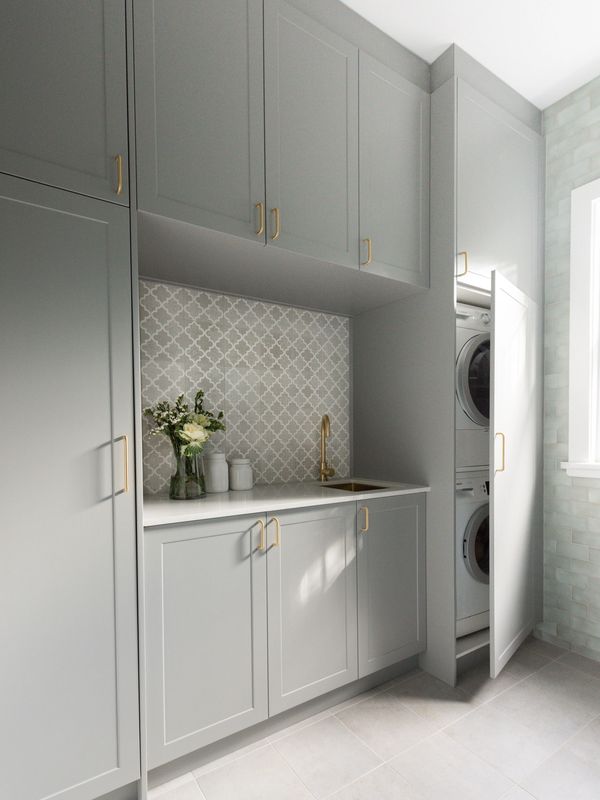 Beautiful and stylish laundry cabinetry design by Simpson Interiors