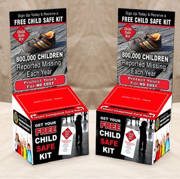 Dual display boxes offering free child safe kits to protect missing children.