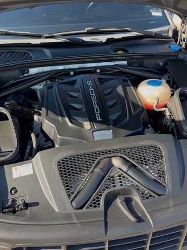 Close-up of a Porsche 3.0 V6 S engine under the hood.