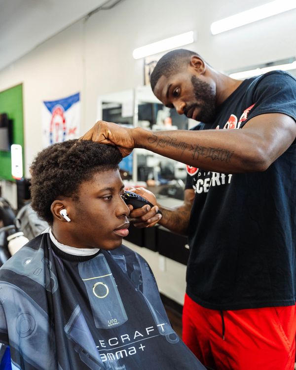 Fade Fellas Barber School student executing a haircut during hands-on training.
