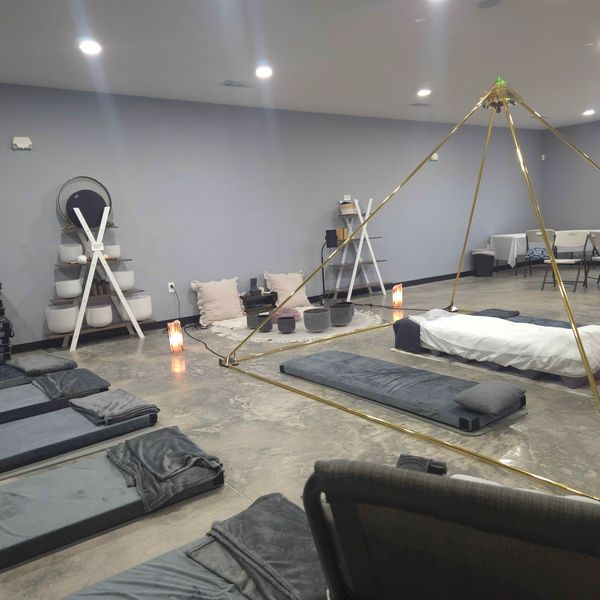 Calm meditation or relaxation room with mats and cushions.