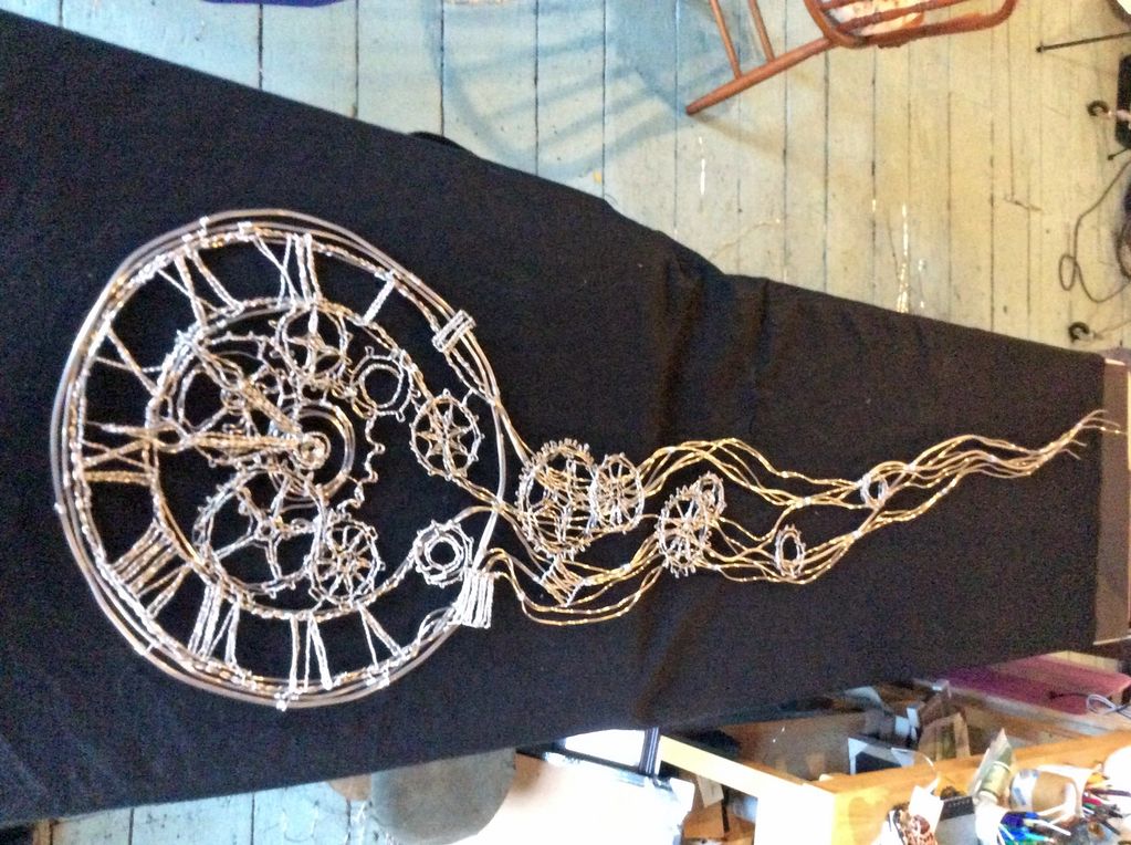 "Tempus Fugit" (Time Flies) wire sculpture wall art clock,  in progress at studio