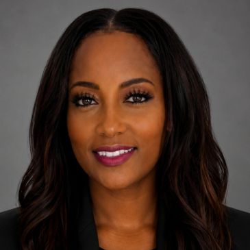 Professional headshot of a woman with long dark hair.