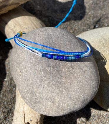 Cord and glass bead bracelet