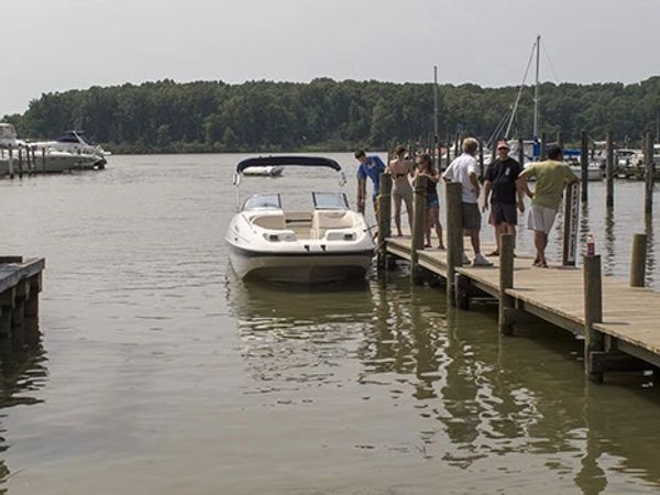 Boat and people at dock - Goose Bay Marina & Campground - Welcome, MD - Oasis Marinas