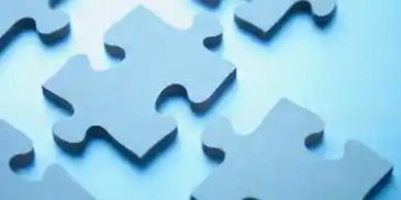 Close-up of interlocking blue puzzle pieces.