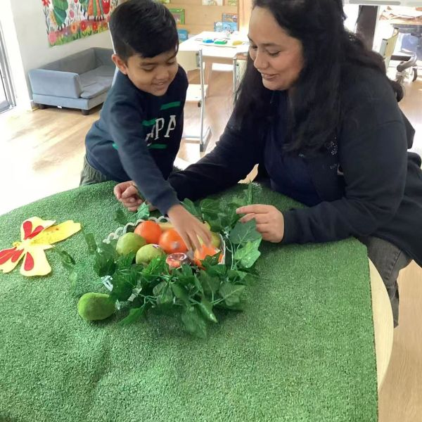 Educator supporting a child through a calm one-to-one interaction at Seven Stars Early Learning Cent