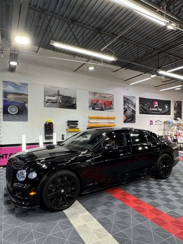 black bentley in shop with paint protection film installed in salt lake city