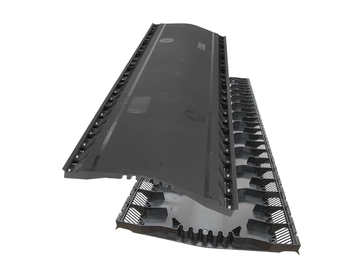 Black plastic cable protector with interlocking design.