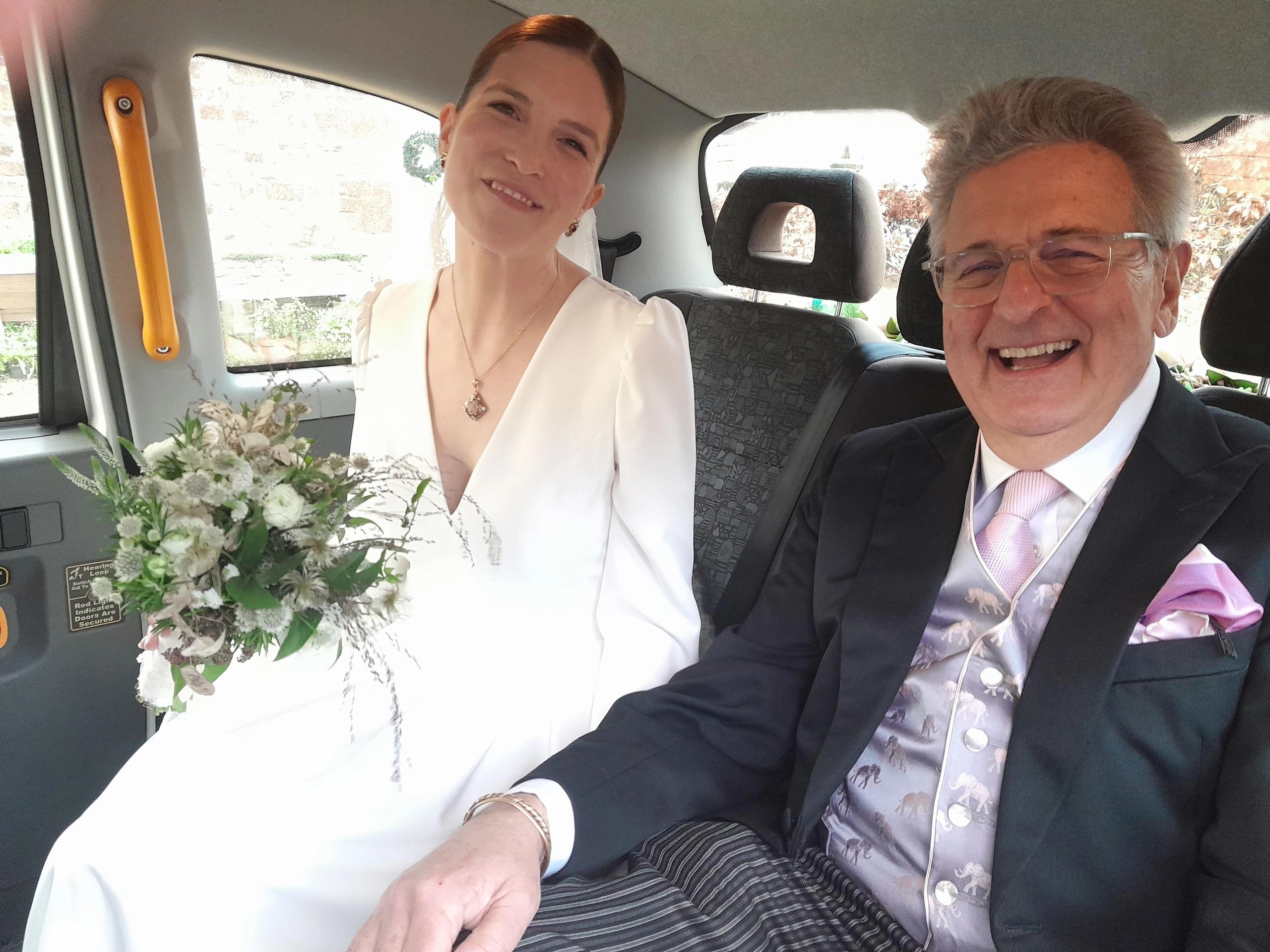 Smiling Bride in Wedding Taxi. Wedding car services