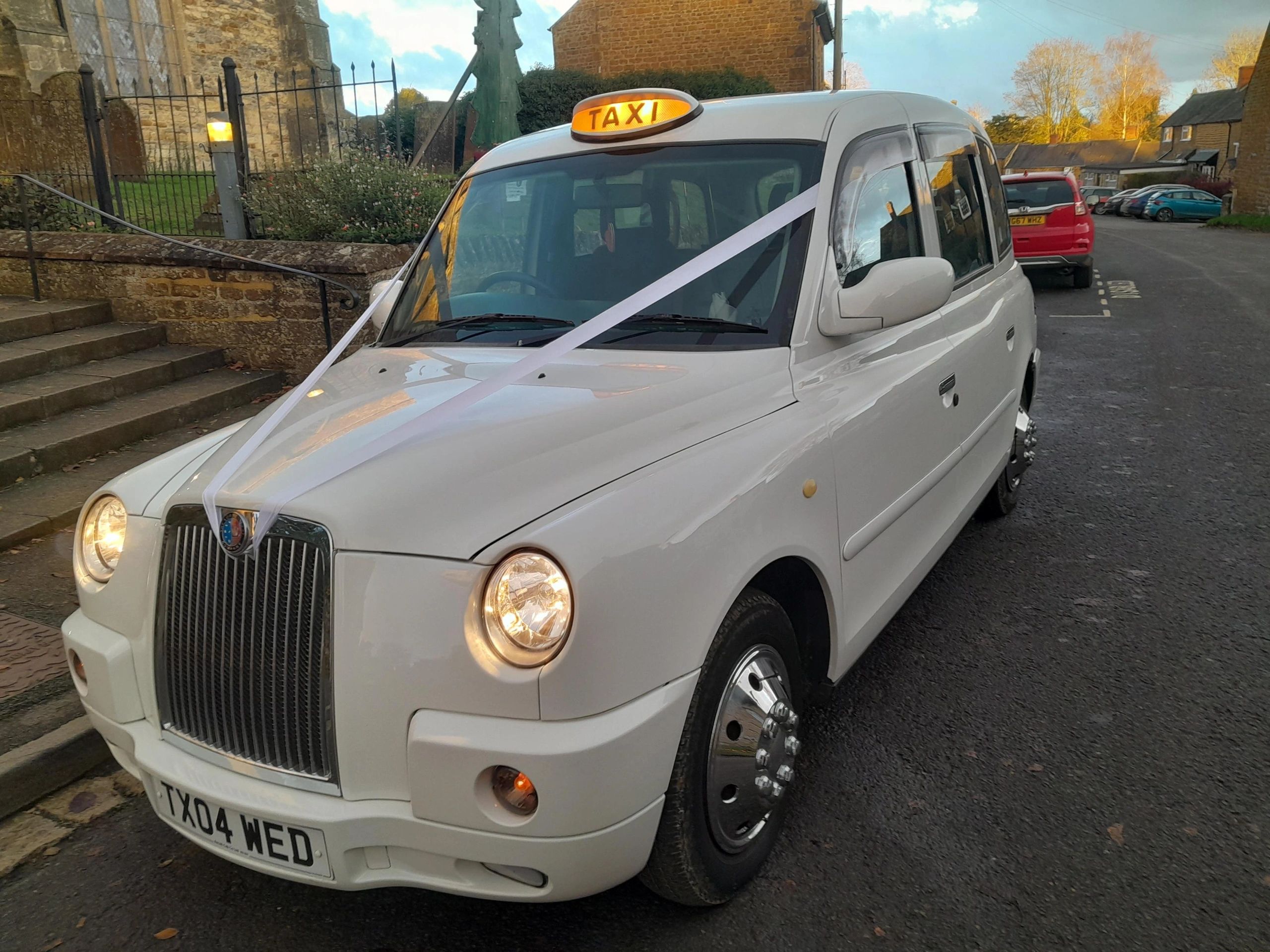 Our lovely wedding taxi outside a church
