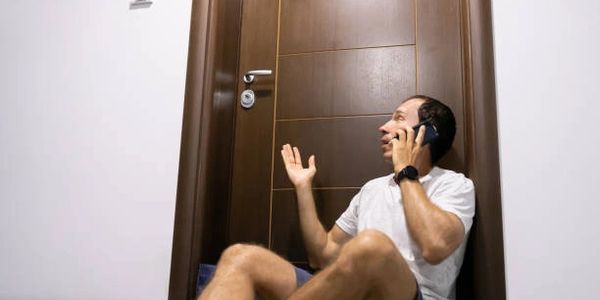 man locked out of house calling a locksmith