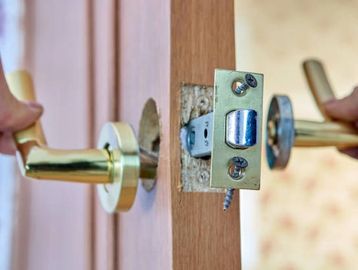 broken stuck door lock being replaced