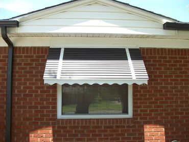 Window and door Stepdown type of awnings. Aluminum frame and stepdown coverings. 14 colors