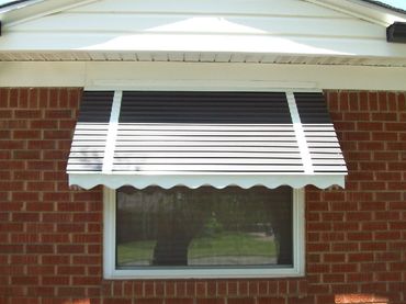 Window and door Stepdown type of awnings. Aluminum frame and stepdown coverings. 14 colors