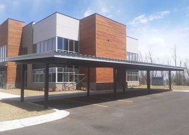 60ft X 20ft I- Beam carport with 26 ga rolled formed sheet metal top