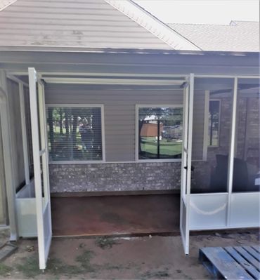 Double doors leading to a porch area outside a house. In this case the customer wanted to pull his r