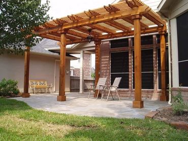 24ft X 16ft X 12ft Wooden framed pergola with double header and rafters . 
