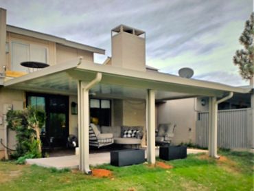 an attached 20x16ft aluminum flat pan with the Santa-Fe trim option in Clay in color, Built in OKC