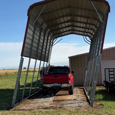 Large RV portable carport that was severely damaged during a high wind event in Tuttle, OK