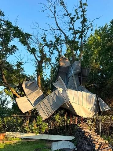 Recent storm damage photo in the Moore/Norman area due to high winds that looks like a storage shed.