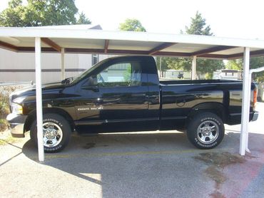 12x20 stand alone single car red steel 6- inch full boxed frame carport that is core drilled