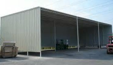 Large open-sided metal storage shed.
