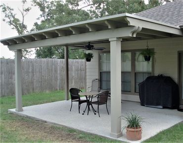 Attached pergola wooden frame with a metal top and trim added to it. 