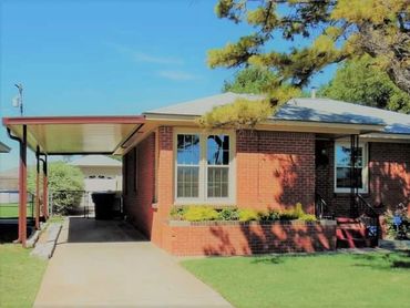 12ft X 30ft attached lean too style aluminum rolled formed flat-pan carport with poles in the ground