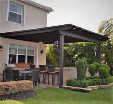 Attached steel framed pergola with a 26ga sheet metal top canopy. Black Cole in color. 