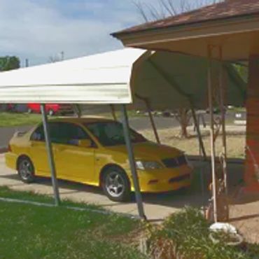 A damaged portable carport structure that came a part in Moore during a high wind event.