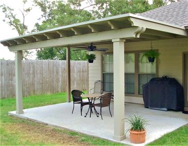 Attached wooden 16ft x 10ft pergola style patio cover with sheet metal canopy top. Clay in color.