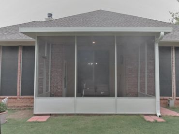 Attached 3-inch SIP patio cover with screened in walls and door for a screen room all in white color