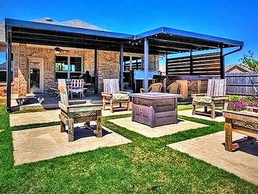 2- attached red steel framed patio covers with front and side rake trim and wooden pricy panels