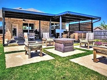 2- attached red steel framed patio covers with front and side rake trim and wooden pricy panels