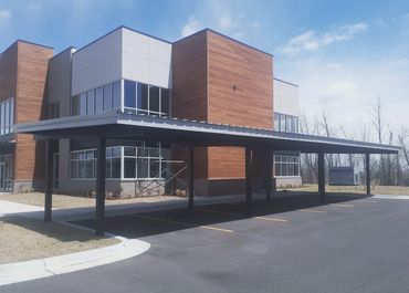 60ft X 20ft I- Beam carport with 26 ga rolled formed sheet metal top