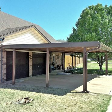 24ft x24ft attached Steel 8 inch C beam 2-1/2 car carport with 6 4x4 poles with guttering brown