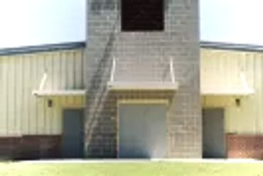 Flat pan store front awning with top framing struts