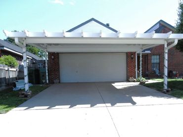 20ftx20ft attached rolled formed aluminum flat-pan carport with the Santa-Fe trim. Yukon. Ok