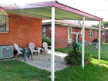 Attached Galvanized steel full boxed frame patio cover with sheet metal top cover and side rake trim