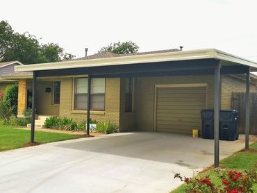 20ftx20ft attached aluminum W-pan rolled formed carport that is wheat in color over bronze color.