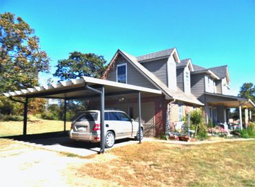 20ft X 20ft attached rolled formed aluminum carport with a Santa-Fe (Alumawood) package Clay/Bronze