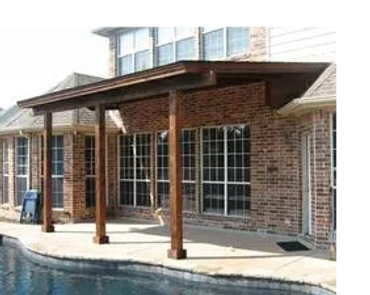 Attached eyebrow style pergola. Cedar wood with darker stain.