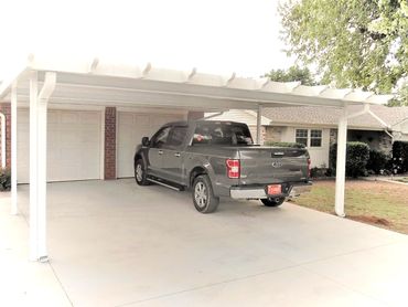 20ft X 20ft attached aluminum flat-pan carport with Santa-Fe pergola trim. in Yukon, OK