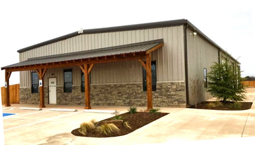 Cedar wood framed building front or sidewalk awnings and covered in sheet metal and trim.