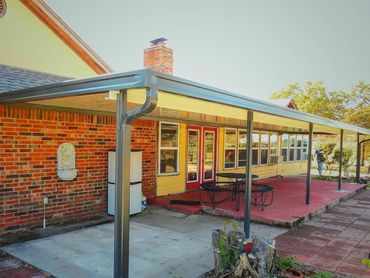 Attached 50ft ft wide X12ft deep conjoined C beam rolled formed aluminum patio cover. Bronze/Ivory