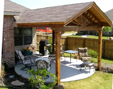 Attached and built into the frame Cedar wood framed cable roof open fan patio cover and comp roof.
